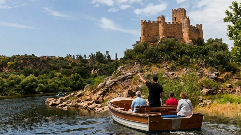 Tourists on a boat with a Living Private Tours guide heading towards Almourol Castle
